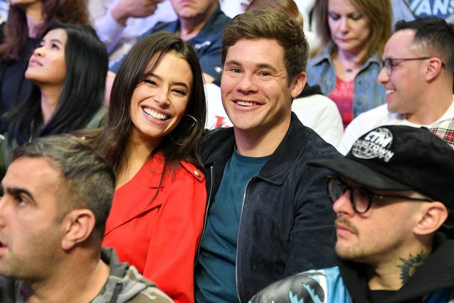 Chloe Bridges and Adam Devine at clippers game